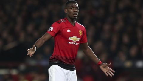 Manchester United's Paul Pogba reacts during the Champions League quarterfinal, first leg, soccer match between Manchester United and FC Barcelona at Old Trafford stadium in Manchester, England, Wednesday, April 10, 2019. (AP Photo/Jon Super)