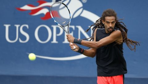 Dustin Brown, of Germany, returns a shot from Roberto Bautista Agut, of Spain, during the second round of the U.S. Open tennis tournament, Thursday, Aug. 31, 2017, in New York. (AP Photo/Adam Hunger)
