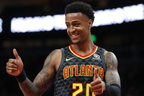 Atlanta Hawks forward John Collins (20) reacts during the first half of an NBA basketball game against the Indiana Pacers on Wednesday, Dec. 26, 2018, in Atlanta. (AP Photo/Todd Kirkland)