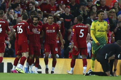 Liverpool players celebrate the second goal of their team during the English Premier League soccer match between Liverpool and Norwich City at Anfield in Liverpool, England, Friday, Aug. 9, 2019. (AP Photo/Dave Thompson)