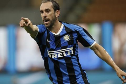 Inter Milan's Diego Godin gestures during a Serie A soccer match between Inter Milan and Torino, at the San Siro stadium in Milan, Italy, Monday, July 13, 2020. (AP Photo/Luca Bruno