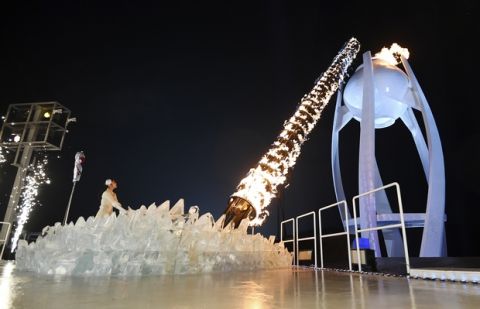 South Korean Olympic figure skating champion Yuna Kim lights the Olympic flame during the opening ceremony of the 2018 Winter Olympics in Pyeongchang, South Korea, Friday, Feb. 9, 2018. (Franck Fife/Pool Photo via AP)