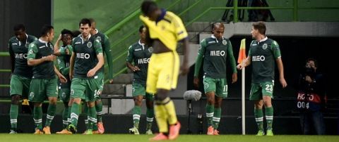 Sporting's forward Carlos Mane (3rd L) celebrates with his teammates after scoring during the UEFA Champions League football match Sporting CP vs NK Maribor at the Jose Alvalade stadium in Lisbon on November 25, 2014.  AFP PHOTO / PATRICIA DE MELO MOREIRA        (Photo credit should read PATRICIA DE MELO MOREIRA/AFP/Getty Images)