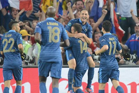 French players celebrate after scoring a goal during the Euro 2012 championships football match Ukraine vs France on June 15, 2012 at the Donbass Arena in Donetsk. AFP PHOTO / PATRICK HERTZOG        (Photo credit should read PATRICK HERTZOG/AFP/GettyImages)