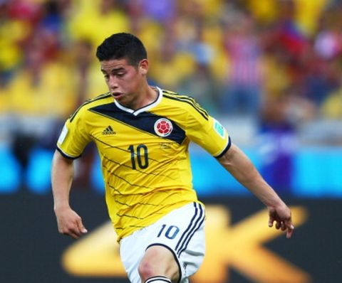 BELO HORIZONTE, BRAZIL - JUNE 14:  James Rodriguez of Colombia controls the ball during the 2014 FIFA World Cup Brazil Group C match between Colombia and Greece at Estadio Mineirao on June 14, 2014 in Belo Horizonte, Brazil.  (Photo by Paul Gilham/Getty Images)