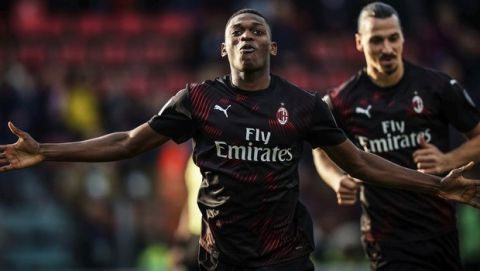Milan's Rafael Leao celebrates after scoring his side's first goal during an Italian Serie A soccer match between Cagliari and Milan in Cagliari, Saturday, Jan. 11, 2020. Behind him is Zlatan Ibrahimovic, who scored the second goal. (Spada(/LaPresse via AP)