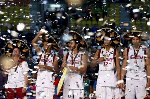 Venezuela's head coach Nestor Garcia (L) looks on next to his players after defeating Argentina in their 2015 FIBA Americas Championship final basketball game, at the Sports Palace in Mexico City, September 12, 2015. REUTERS/Henry Romero