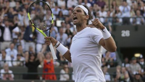Spain's Rafael Nadal reacts after winning a point against Luxembourg's Gilles Muller during their Men's Singles Match on day seven at the Wimbledon Tennis Championships in London Monday, July 10, 2017. (AP Photo/Tim Ireland)