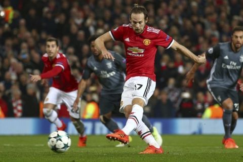 Manchester United's Daley Blind scores his side's second goal from the penalty spot during the Champions League group A soccer match between Manchester United and Benfica, at Old Trafford, in Manchester, England, Tuesday, Oct. 31, 2017. (AP Photo/Dave Thompson)
