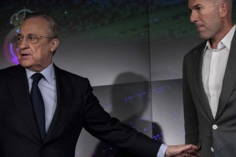 Newly appointed Real Madrid head coach Zinedine Zidane, and Real Madrid President Florentino Perez  attend a press conference in Madrid, Monday March 11, 2019. Real Madrid picked one of its most successful coaches to try to end one of its worst crises. Zidane is returning to coach Real Madrid, the club he led to three straight Champions League titles. (AP Photo/Bernat Armangue)