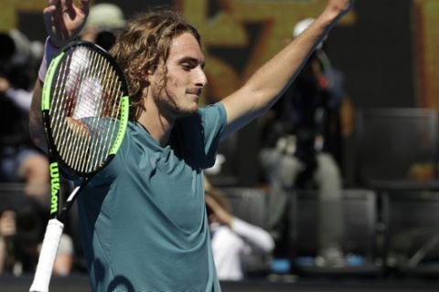 Greece's Stefanos Tsitsipas celebrates after defeating Spain's Roberto Bautista Agut in their quarterfinal match at the Australian Open tennis championships in Melbourne, Australia, Tuesday, Jan. 22, 2019. (AP Photo/Mark Schiefelbein)