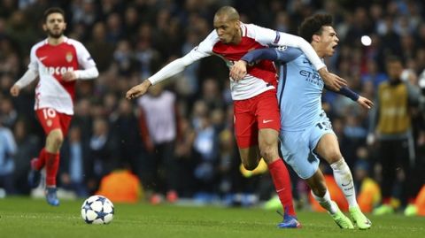 Monaco's Fabinho, left, holds off Manchester City's Leroy Sane during the Champions League round of 16 first leg soccer match between Manchester City and Monaco at the Etihad Stadium in Manchester, England, Tuesday Feb. 21, 2017. (AP Photo/Dave Thompson)