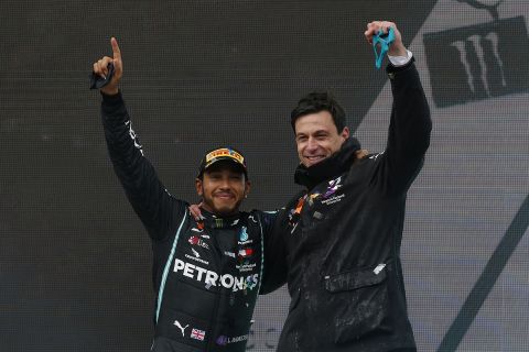Mercedes driver Lewis Hamilton of Britain and Mercedes team principal Toto Wolff, right, celebrate after Hamilton won the race and his seventh world championship at the Formula One Turkish Grand Prix at the Istanbul Park circuit racetrack in Istanbul, Sunday, Nov. 15, 2020. (AP Photo/Kenan Asyali, Pool)