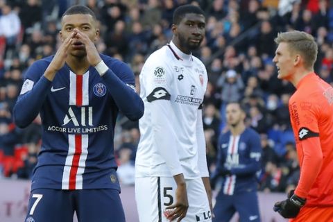 PSG's Kylian Mbappe, left, reacts after missing a scoring chance during the French League One soccer match between Paris-Saint-Germain and Dijon, at the Parc des Princes stadium in Paris, France, Saturday, Feb. 29, 2020. (AP Photo/Michel Euler)