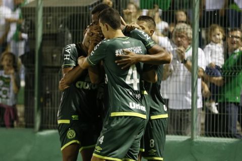 Luiz Otavio of Brazil's Chapecoense, center, celebrates with teammates after scoring against Colombia's Atletico Nacional, during a Recopa Sudamericana first leg final soccer match in Chapeco, Brazil, Tuesday, April 4, 2017. (AP Photo/Andre Penner)