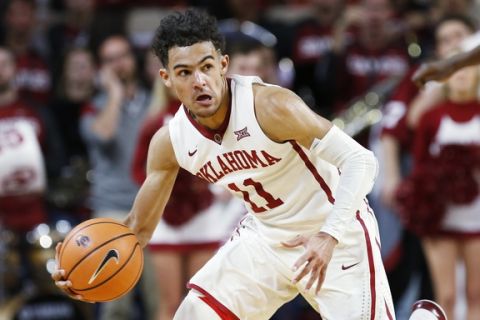 Oklahoma guard Trae Young heads up court in the second half of an NCAA college basketball game against Oklahoma State in Norman, Okla., Wednesday, Jan. 3, 2018. Oklahoma won 109-89. (AP Photo/Sue Ogrocki)
