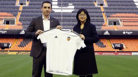 FILE -In this Thursday, Dec. 3, 2015 file photo, former Manchester United and England defender Gary Neville and Layhoon Chan, President of Valencia poses for photographers in the Mestalla stadium after a press conference in Valencia, Spain. Chan  has apologized to fans for the teams wretched year. Chan, who runs Valencia for Singapore owner Peter Lim, says 2016 has been a difficult year and I want to ask forgiveness from all of Valencias fans for the poor season. (AP Photo/Alberto Saiz, File)