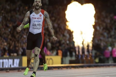 Turkey's Ramil Guliyev celebrates after winning the gold medal in the Men's 200m final during the World Athletics Championships in London, Thursday, Aug. 10, 2017. (AP Photo/David J. Phillip)