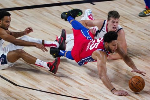 Philadelphia 76ers guard Ben Simmons (25) goes for a loose ball with Washington Wizards guard Jerome Robinson, left, and forward Moritz Wagner, right. during the first half of an NBA basketball game Wednesday, Aug. 5, 2020 in Lake Buena Vista, Fla. (AP Photo/Ashley Landis)