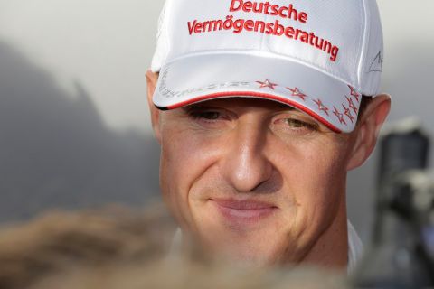 Mercedes driver Michael Schumacher of Germany talks to reporters following his crash during the second practice session for the Japanese Formula One Grand Prix at the Suzuka Circuit in Suzuka, Japan, Friday, Oct. 5, 2012. (AP Photo/Shizuo Kambayashi)