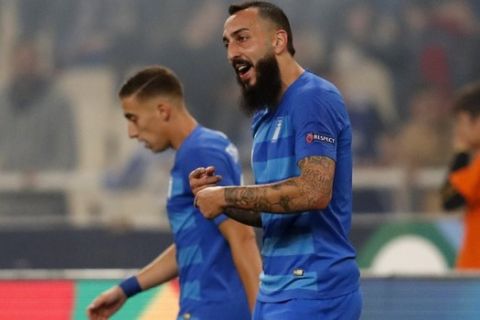 Greece's Kostas Mitroglou, right, celebrates after scoring the opening goal of his team during the UEFA Nations League soccer match between Greece and Hungary at Olympic stadium in Athens, Friday, Oct. 12, 2018. (AP Photo/Thanassis Stavrakis)