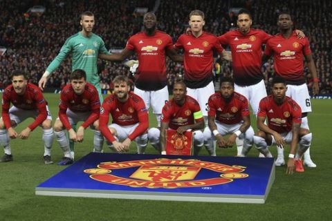 Manchester United players pose before the Champions League quarterfinal, first leg, soccer match between Manchester United and FC Barcelona at Old Trafford stadium in Manchester, England, Wednesday, April 10, 2019. (AP Photo/Jon Super)