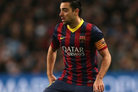 MANCHESTER, ENGLAND - FEBRUARY 18:  Xavi Hernandez of Barcelona in action during the UEFA Champions League Round of 16 first leg match between Manchester City and Barcelona at the Etihad Stadium on February 18, 2014 in Manchester, England.  (Photo by Clive Brunskill/Getty Images)