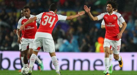 "BARCELONA, SPAIN - MARCH 16: Mohamed Elneny (R) of Arsenal celebrates scoring his team's first goal with his team mate Francis Coquelin (C) during the UEFA Champions League round of 16, second Leg match between FC Barcelona and Arsenal FC at Camp Nou on March 16, 2016 in Barcelona, Spain.  (Photo by Richard Heathcote/Getty Images)"