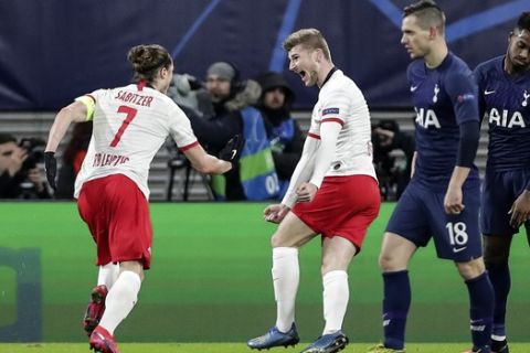 Leipzig's scorer Marcel Sabitzer celebrates with Timo Werner beside Tottenham's Giovani Lo Celso and Ryan Sessegnon, from left, after scoring the opening goal during the Champions League round of 16, 2nd leg soccer match between RB Leipzig and Tottenham Hotspur in Leipzig, Germany, Tuesday, March 10, 2020. (AP Photo/Michael Sohn)