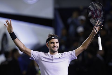 Roger Federer of Switzerland celebrates after defeating Rafael Nadal of Spain in their men's singles final match of the Shanghai Masters tennis tournament at Qizhong Forest Sports City Tennis Center in Shanghai, China, Sunday, Oct. 15, 2017. (AP Photo/Andy Wong)