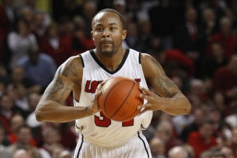 Louisville's Jerry Smith in action during the second half of their NCAA college basketball game against Notre Dame in Louisville, Ky., Wednesday, Feb. 17, 2010.  (AP Photo/Ed Reinke)