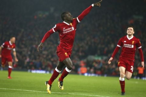 Liverpool's Sadio Mane celebrates scoring his side's third goal during the English Premier League soccer match between Liverpool and Manchester City at Anfield Stadium, in Liverpool, England, Sunday Jan. 14, 2018. (AP Photo/Dave Thompson)