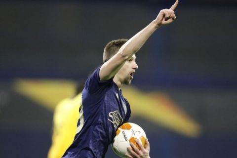 Dinamo Zagreb's Mislav Orsic celebrates after scoring his side's second goal during the Europa League round of 16 second leg soccer match between Dinamo Zagreb and Tottenham Hotspur at the Maksimir stadium in Zagreb, Croatia, March 18, 2021. (AP Photo/Darko Bandic)
