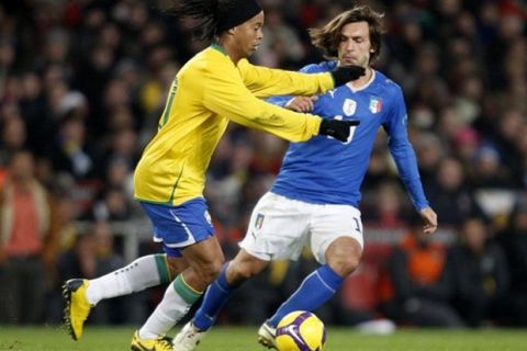 Brazil's Ronaldinho tries to get past Italy's Andrea Pirlo