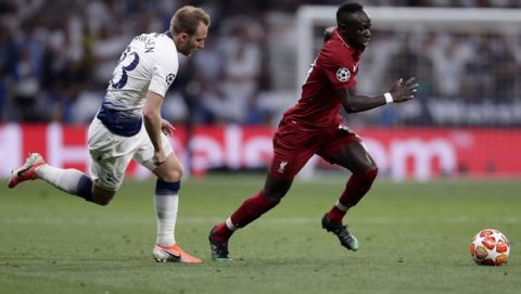 Tottenham's Christian Eriksen fights for the ball against Liverpool's Sadio Mane during the Champions League final soccer match between Tottenham Hotspur and Liverpool at the Wanda Metropolitano Stadium in Madrid, Saturday, June 1, 2019. (AP Photo/Manu Fernandez)