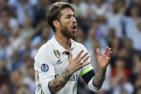 Real Madrid's Sergio Ramos reacts after missing a chance to score during the Champions League quarterfinal second leg soccer match between Real Madrid and Bayern Munich at Santiago Bernabeu stadium in Madrid, Spain, Tuesday April 18, 2017. (AP Photo/Francisco Seco)
