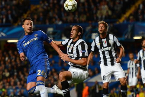 LONDON, ENGLAND - SEPTEMBER 19:  John Terry of Chelsea is put under pressure by Giorgio Chiellini of Juventus during the UEFA Champions League Group E match between Chelsea and Juventus at Stamford Bridge on September 19, 2012 in London, England.  (Photo by Mike Hewitt/Getty Images)