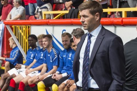 Rangers manager Steven Gerrard looks on during their Scottish Premiership soccer match against Aberdeen at Pittodrie Stadium, Aberdeen, Scotland, Sunday, Aug. 5, 2018. Steven Gerrard was denied a win in his first Scottish league game as Rangers manager by an injury-time goal on Sunday. Aberdeen struck in the third minute of stoppage time to earn a 1-1 draw against Rangers on the opening weekend of the Scottish Premiership. (Jeff Holmes/PA via AP)