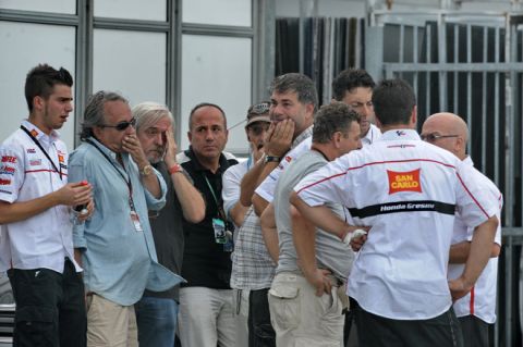 Crew members of the Honda team of MotoGP rider Marco Simoncelli of Italy gather outside a medical centre where the rider was taken following a fatal crash at the Malaysian Grand Prix MotoGP race at Sepang on October 23, 2011. Italy's Marco Simoncelli died of injuries sustained in a crash that resulted in the cancellation of the Malaysian MotoGP, in the latest tragedy to hit motor sports. AFP PHOTO / ROSLAN RAHMAN (Photo credit should read ROSLAN RAHMAN/AFP/Getty Images)