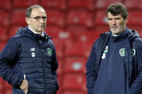 Irish national soccer coach Martin O'Neill, left, and assistant coach Roy Keane attend a practice session of the Irish national soccer team at Parken stadium in Copenhagen, Denmark, Friday, Nov. 10, 2017. Denmark will host the first of two World Cup qualifying play-off matches between Denmark and Ireland on Saturday. (Jens Dresling/Ritzau Foto via AP)