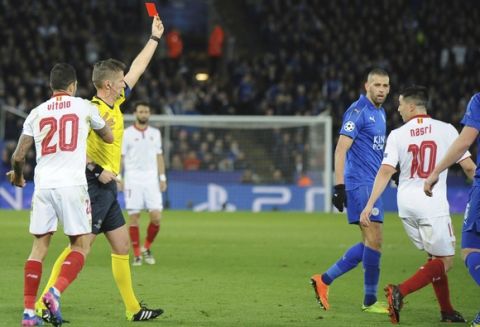 Sevilla's Samir Nasri, right, gets a red card after an incident with Leicester's Jamie Vardy during the Champions League round of 16 second leg soccer match between Leicester City and Sevilla at the King Power Stadium in Leicester, England, Tuesday, March 14, 2017. (AP Photo/Rui Vieira)