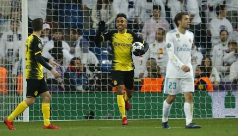 Dortmund's Pierre-Emerick Aubameyang, center, celebrates after scoring his side's first goal during the Champions League Group H soccer match between Real Madrid and Borussia Dortmund at the Santiago Bernabeu stadium in Madrid, Spain, Wednesday, Dec. 6, 2017. (AP Photo/Paul White)