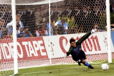 Argentina's goalkeeper Sergio Javier Goycochea dives and fails to stop the ball entering his net after West Germany's Andreas Brehme, unseen, scored a penalty in the West Germany versus Argentina World Cup final in Rome, Italy, July 8, 1990. This was the only goal in the match. (AP Photo)