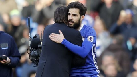 Chelsea's manager Antonio Conte, left hugs his player Chelsea's Cesc Fabregas after the end of the English Premier League soccer match between Chelsea and Arsenal at Stamford Bridge stadium in London, Saturday, Feb. 4, 2017. Chelsea won the game 3-1. (AP Photo/Frank Augstein)