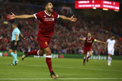Liverpool's Emre Can celebrates scoring his sides first goal during the Champions League qualifying play-off second leg soccer match between Liverpool and Hoffenheim at Anfield stadium in Liverpool, England, Wednesday, Aug. 23, 2017. (AP Photo/Dave Thompson)