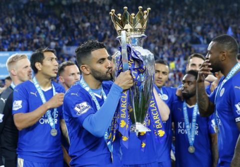 Britain Soccer Football - Leicester City v Everton - Barclays Premier League - King Power Stadium - 7/5/16
Leicester City's Riyad Mahrez celebrates winning the premier league as he kisses the trophy
Reuters / Darren Staples
Livepic
EDITORIAL USE ONLY. No use with unauthorized audio, video, data, fixture lists, club/league logos or "live" services. Online in-match use limited to 45 images, no video emulation. No use in betting, games or single club/league/player publications.  Please contact your account representative for further details.
