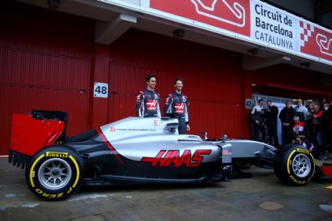 MONTMELO, SPAIN - FEBRUARY 22:  Romain Grosjean of France and Haas F1 and Esteban Gutierrez of Mexico and Haas F1 pose with the new car outside the garage during day one of F1 winter testing at Circuit de Catalunya on February 22, 2016 in Montmelo, Spain.  (Photo by Mark Thompson/Getty Images)