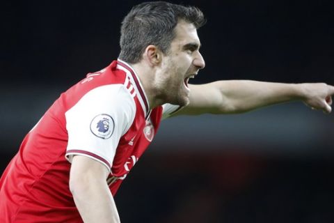 Arsenal's Sokratis Papastathopoulos shouts during the English Premier League soccer match between Arsenal and Brighton, at the Emirates Stadium in London, Thursday, Dec. 5, 2019. (AP Photo/Frank Augstein)