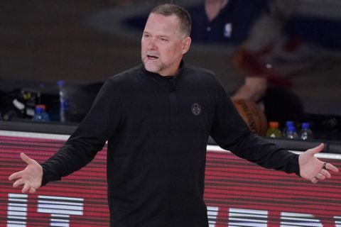 Denver Nuggets head coach Michael Malone gestures in the first half of an NBA conference semifinal playoff basketball game Thursday, Sept 3, 2020, in Lake Buena Vista Fla. (AP Photo/Mark J. Terrill)