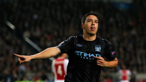 AMSTERDAM, NETHERLANDS - OCTOBER 24:  Samir Nasri of Manchester City celebrates scoring the first goal of the game during the Group D UEFA Champions League match between AFC Ajax and Manchester City FC at Amsterdam ArenA on October 24, 2012 in Amsterdam, Netherlands.  (Photo by Dean Mouhtaropoulos/Getty Images)